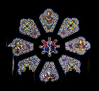 Stained glass window representing the Virgin Mary and various saints