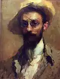Portrait of a man with hat and glasses