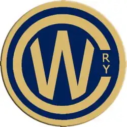 A blue circle with a large gold C encircling a gold W as the logo