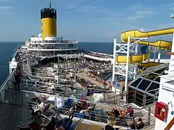 Pool deck space and water slide on Costa Magica