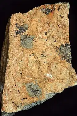 Metamict grey-black Th-uranitite (or possibly davidite) on granitic gneiss from Crokers Well, Olary, South Australia
