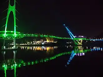 The bridge at night, decorated with colourful LED lights