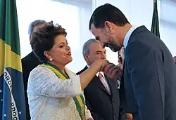 Felipe of Spain, then Prince of Asturias, kisses the hand of President Rousseff.