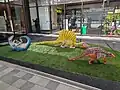 Sculptures of dinosaurs outside the Echizen Railway platforms