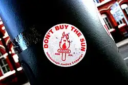 Sticker with Don't Buy The Sun messaging