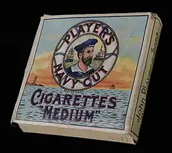 A box of Player's Navy Cut Cigarettes Medium, with bust of sailor in a lifebelt against background of seascape