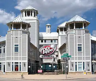 The home plate façade of the ballpark features gray siding and turret roofs.