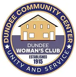 Round blue and gold logo with a drawing of the community center building