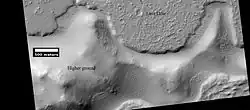 Lava flow. Lava flow stopped when it encountered the higher ground of a mound. Picture was taken with HiRISE under HiWish program.
