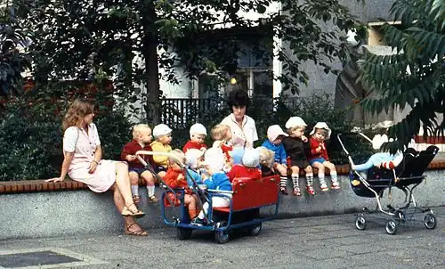 East Berlin child minders, with multiple-seat prams in 1984
