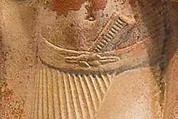 Detail of Egyptian statue dating from 2350 BC depicting a reef knot securing a belt