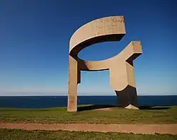 Elogio del Horizonte (Eulogy to the Horizon), concrete (1989), a 10-meter-tall (33 ft) contemporary monumental sculpture, by Eduardo Chillida, at Gijon, Spain