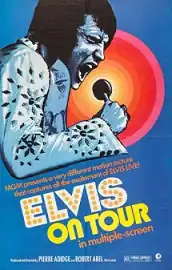 Promotional poster for Elvis on Tour. The illustration features Elvis Presley wearing a jumpsuit and singing to a microphone. The poster has a blue background, while surrounding the microphone, circles on a color scale from orange to red from the inner to the outer circle are seen. The caption under Presley's figure reads "MGM presents a very different motion picture that captures all of the excitement of ELVIS LIVE!". Under the caption, the title reads "ELVIS ON TOUR" "in multiple screen"