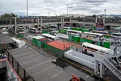 Multiple transport units are parked.