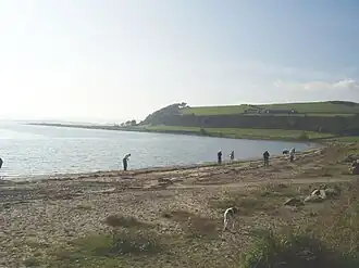 A curved bay with a sandy foreshore