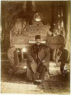 Naser al-Din Shah on the steps of the Sun Throne at the Mirror Hall