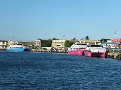 Fast craft ferries from 2GO Travel and Oceanjet at the fast ferry terminal on the Iloilo River, going to Bacolod.