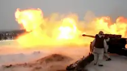 Finnish artillery crew firing an M-46