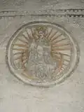 Virgin Mary possibly depicted as Stella Maris on the wall of the church.