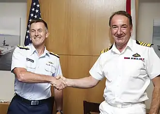 Admiral Sir George Zambellas wearing white No. 3WA dress.