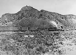 The Jupiter leads the train that carried the ceremonial spike, Leland Stanford, one of the "Big Four" owners of the Central Pacific Railroad, and other railway officials to the Golden Spike Ceremony.