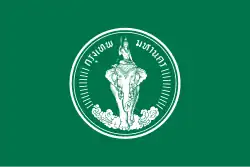 A green rectangular flag with the seal of Bangkok in the centre