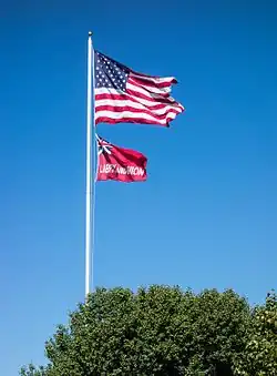 The flag of Taunton flies beneath the flag of the United States over Taunton Green