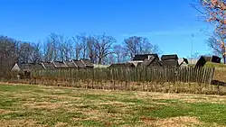 Log buildings along a reservoir shoreline