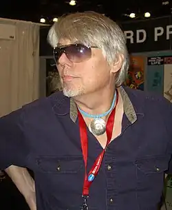 Brunner in profile, wearing sunglasses