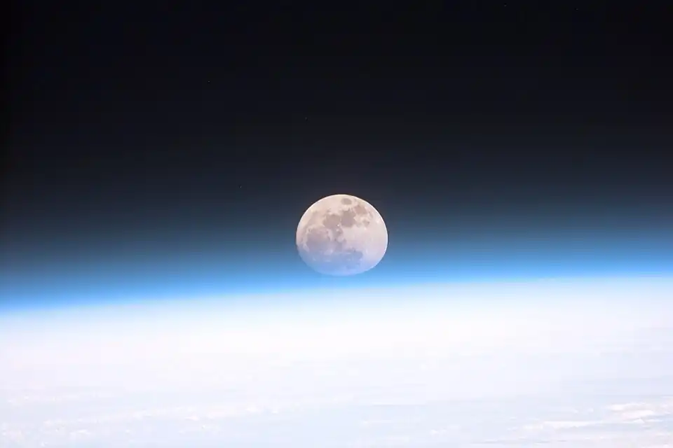Image 11Astronauts aboard the Space Shuttle Discovery recorded this rarely seen phenomenon of the full Moon partially obscured by the atmosphere of Earth. The image was recorded with an electronic still camera at 15:15:15 GMT, Dec. 21, 1999. (Credit: NASA.) (from Portal:Earth sciences/Selected pictures)