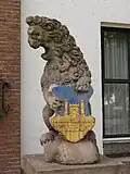 Town hall lion guardian with coat of arms