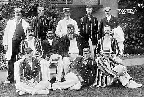 Black and white photograph showing a cricket team
