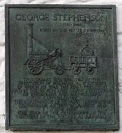 Colour photograph of a bronze memorial tablet