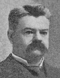 A headshot photograph of George Van Horn