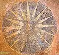 Mosaic depicting the Vergina Sun at the archaeological site of Gitanae