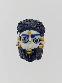 Face bead; mid-4th–3rd century BC; glass; height: 2.7  cm; Metropolitan Museum of Art