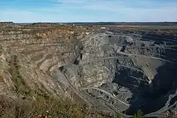 A mined-out open-pit on the site of the mountain. 2020