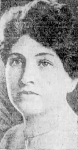 A white woman with dark hair