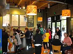 A small cafe filled with people.