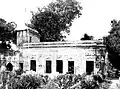 The gurdwara seen in a fairly pristine condition in 1950, from the northeast. The architectural details on the exterior of the building is visible.