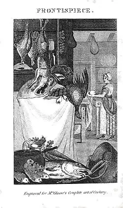 View of a kitchen showing game hanging and fish lain out