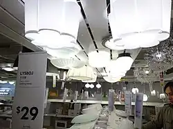 Various contemporary lamps for sale at an IKEA store