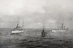 HMS Liverpool and HMS Fury, together with RMS Olympic, try to take HMS Audacious in tow. The view is from the passenger areas of RMS Olympic