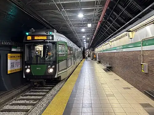 A light rail vehicle in a subway station with a low platform