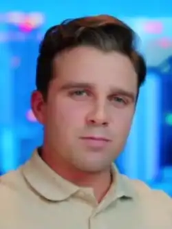 Head shot of Hinkle wearing a tan colored shirt