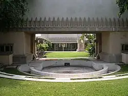 View from the eastern pool. In the background are the central courtyard and living room.