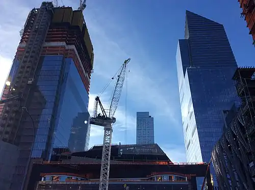 Under construction on the left with the completed 10 Hudson Yards on the right in May 2017.
