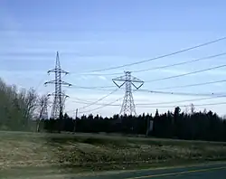 450 kV HVDC line (at right), on south side of Autoroute 20 east of the Nicolet station near Sainte-Eulalie, Quebec.