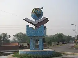 Photograph of the sculpture of logo at the entrance of the institute
