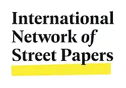 The logo consists of the text "International Network of Street Papers" in black with a yellow line underneath. The line sits at a slight angle and is distresse.